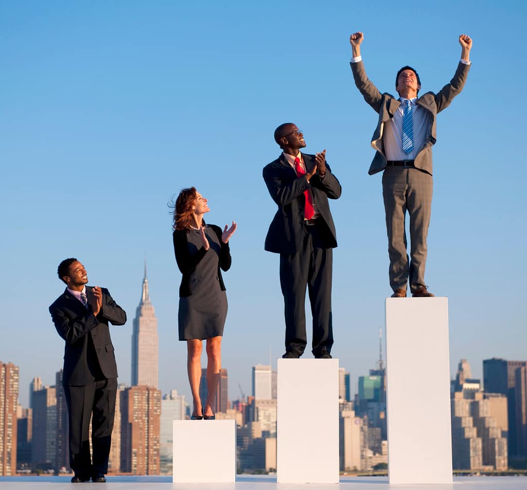 Business people on ascending pedestals representing career growth, success, and effective Internal Mobility and Succession Planning.